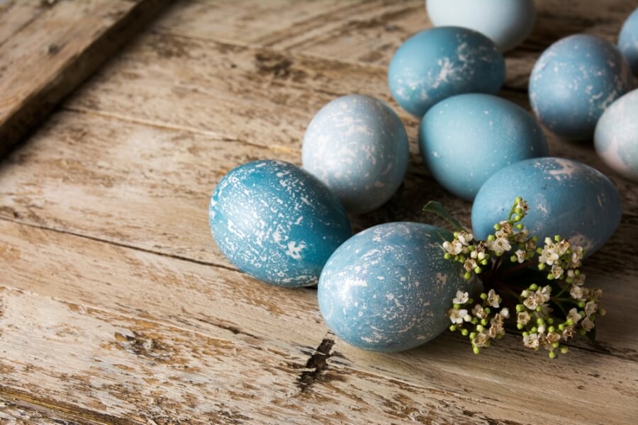 Blue Easter eggs and bouquet of flowers
